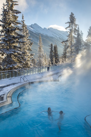 ca_couples_winter banff upper hot springs_view