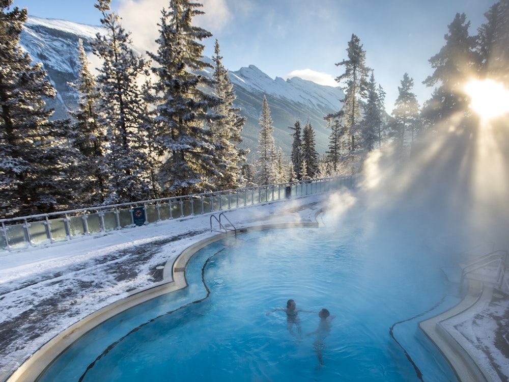 ca_couples_winter banff upper hot springs_view