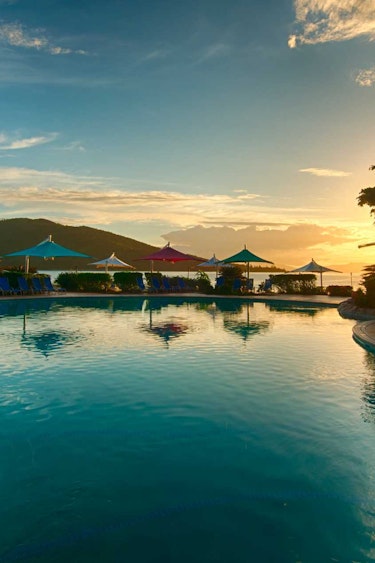 Aus tropical island pool sunset view family stays luxury