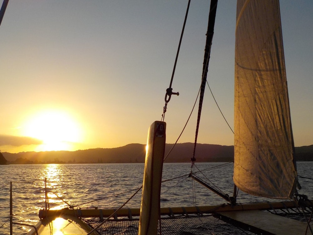 Nz coromandel sail sunset boom sailing