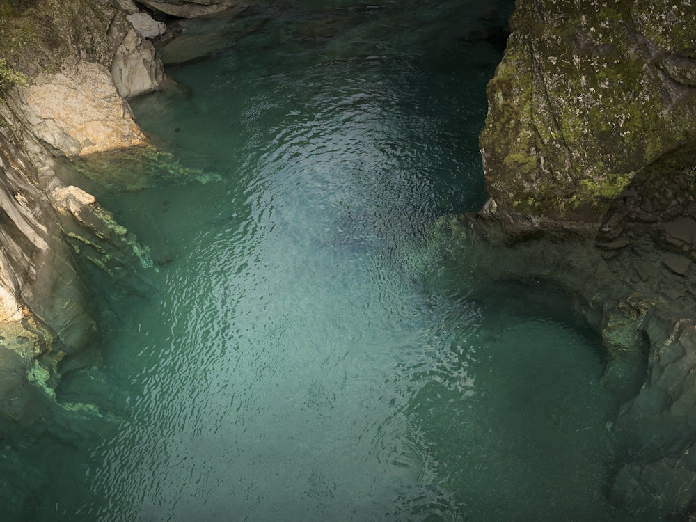 Refreshing dip at Haast Pass Blue Pools | New Zealand active holiday