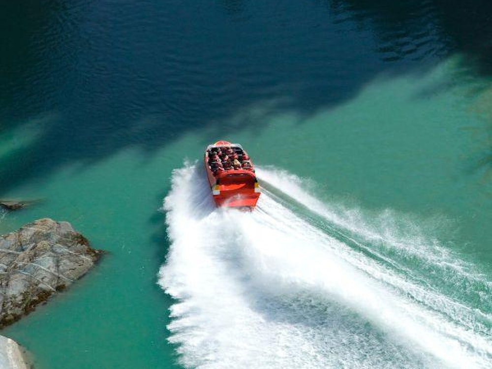 A jet boat on turquoise water
