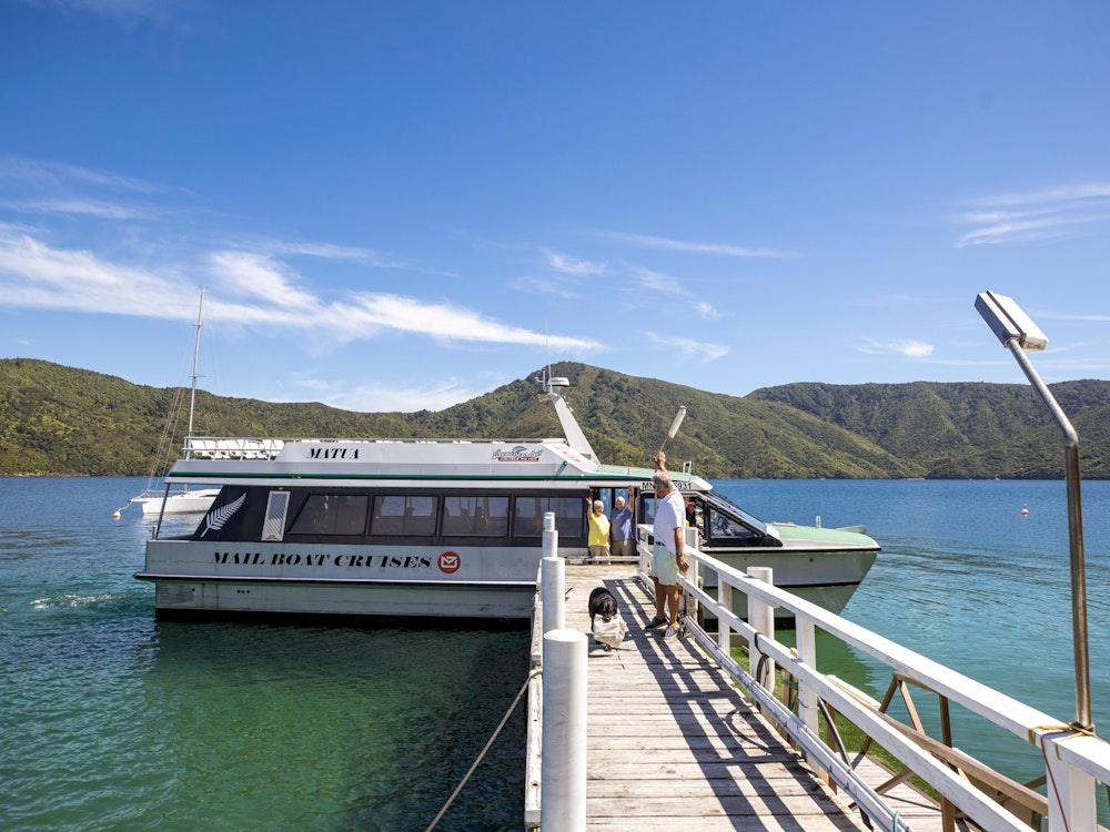 A white boat docked at the pier