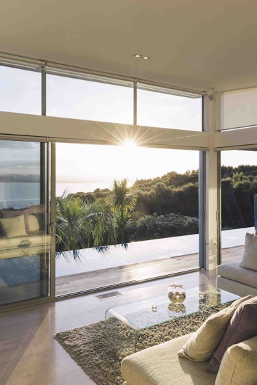 Nz bay of islands villa livingroom view family stays luxury