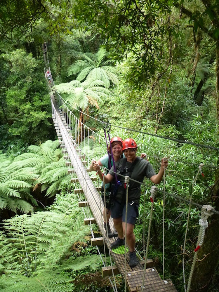 Crossing the swing bridge, Waitomo